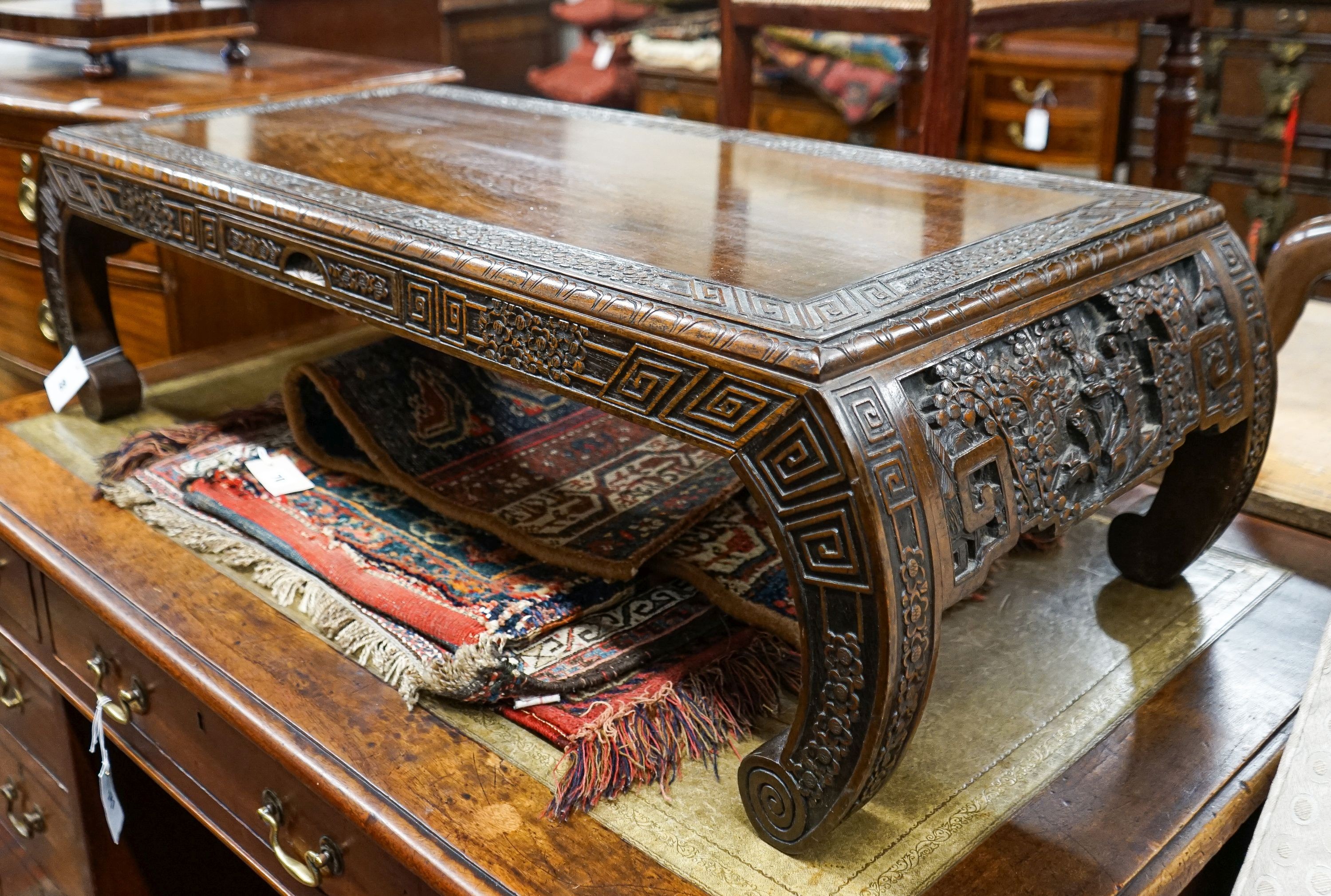 A Chinese rectangular carved top hardwood table, width 104cm, depth 46cm, height 29cm